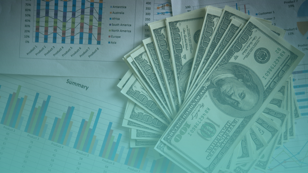 Financial charts and cash illustrating business profitability and pricing strategy.