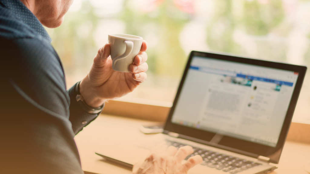 Commercial real estate professional using LinkedIn on a laptop for networking and AI search visibility